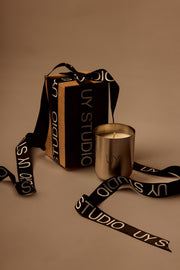 UY Studio U Candle Premium luxury scented candle in a minimalist stainless steel jar, hand-poured in Germany, with rich Oud, Amber, Vanilla and Musk fragrance notes.