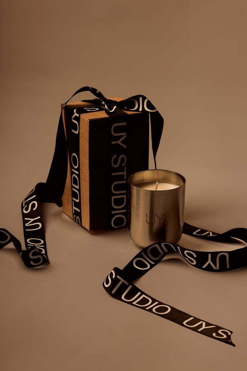 UY Studio S Steel Candle luxury handmade scented candle in a minimalist stainless steel jar, crafted in Berlin, Germany. High-quality fragrance with Bergamot, Rose, Cardamom, Jasmine and Amber notes.