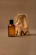 UY Studio X unisex room spray 100 ml amber glass bottle with engraved logo and black cap, Patchouli, Sandalwood, Agarwood, Tonka bean