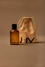 UY Studio X unisex room spray 100 ml amber glass bottle with engraved logo and black cap, Patchouli, Sandalwood, Agarwood, Tonka bean