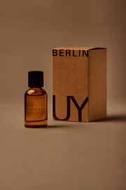 UY Studio T unisex eau de parfum, 50 ml amber glass bottle with engraved logo and black cap, rose, cedar, black tea, musk