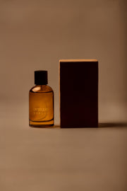 UY Studio X unisex room spray 100 ml amber glass bottle with engraved logo and black cap, Patchouli, Sandalwood, Agarwood, Tonka bean