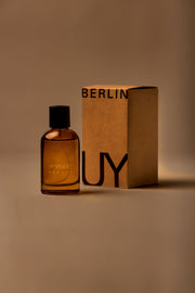 UY Studio X unisex room spray 100 ml amber glass bottle with engraved logo and black cap, Patchouli, Sandalwood, Agarwood, Tonka bean