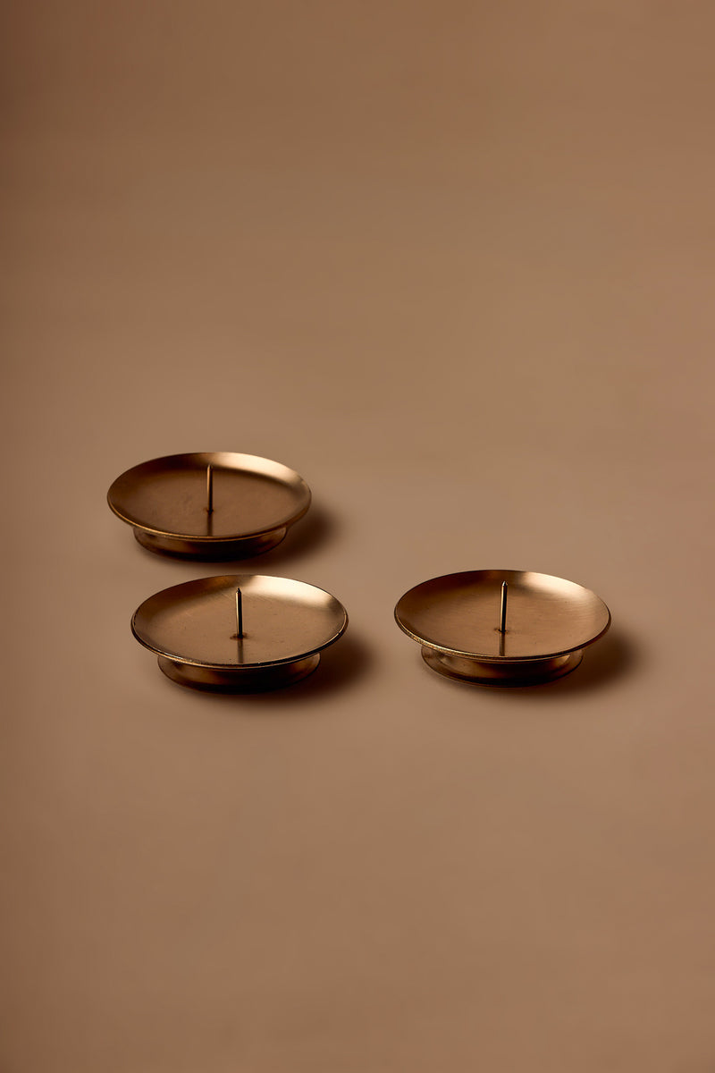 UY Studio CORE Flower Stand made of stainless steel, minimalist Ikebana flower holder and candle holder for modern interior design.