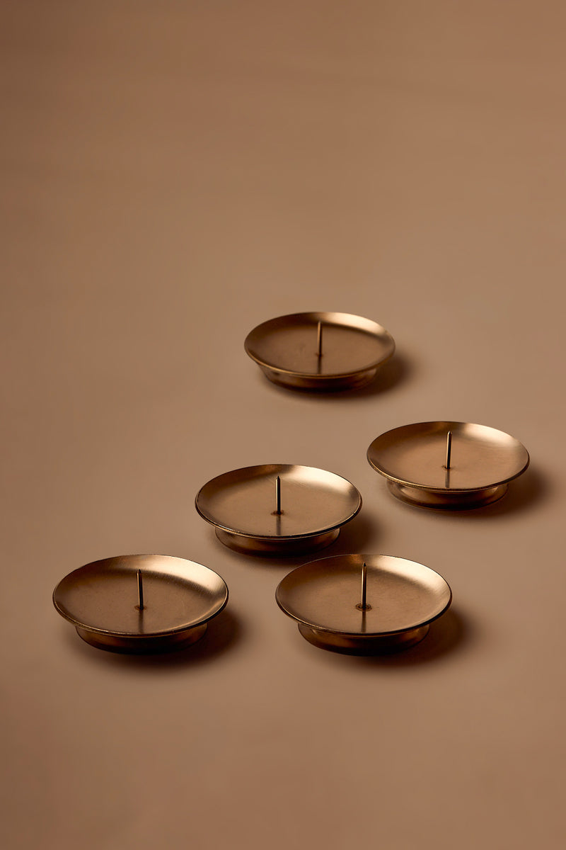 UY Studio CORE Flower Stand made of stainless steel, minimalist Ikebana flower holder and candle holder for modern interior design.