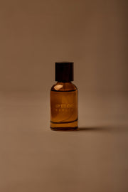 UY Studio T unisex eau de parfum, 50 ml amber glass bottle with engraved logo and black cap, rose, cedar, black tea, musk