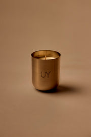 UY Studio S Steel Candle luxury handmade scented candle in a minimalist stainless steel jar, crafted in Berlin, Germany. High-quality fragrance with Bergamot, Rose, Cardamom, Jasmine and Amber notes.