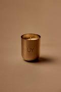UY Studio U Candle Premium luxury scented candle in a minimalist stainless steel jar, hand-poured in Germany, with rich Oud, Amber, Vanilla and Musk fragrance notes.