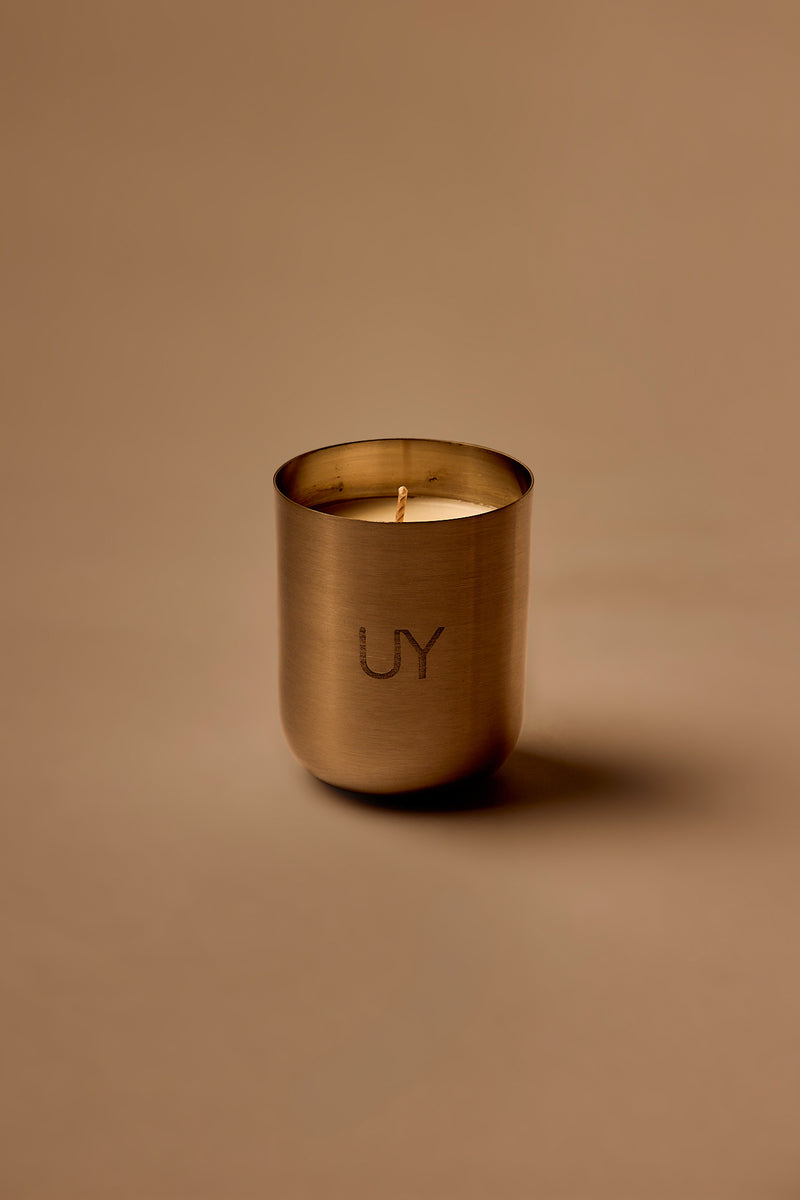 UY Studio U Candle Premium luxury scented candle in a minimalist stainless steel jar, hand-poured in Germany, with rich Oud, Amber, Vanilla and Musk fragrance notes.